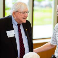 President Emeritus Don Lubbers talking with guests at the Retiree Reception.